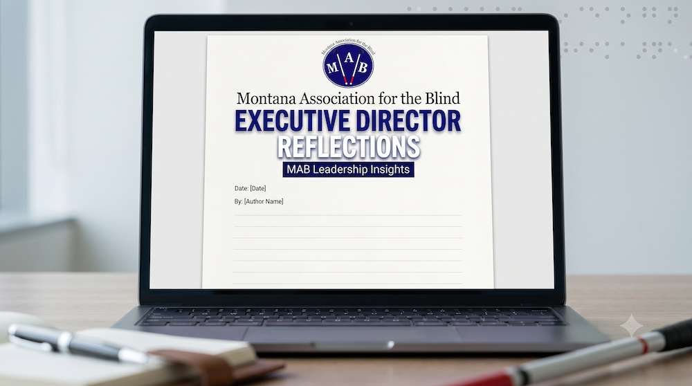 A laptop sitting on a desk, displaying a draft of the executive Director Reflections document.